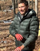 Alarum (2025) Scott Eastwood Green Puffer Jacket